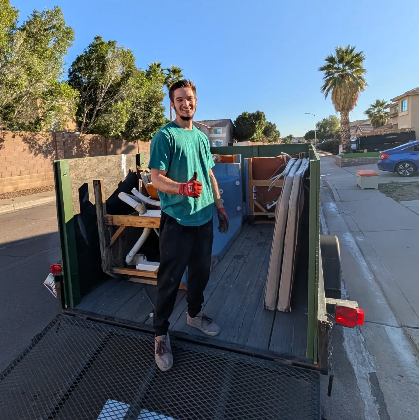 Reset Junk Removal crew loading furniture for a North Phoenix Arizona pickup