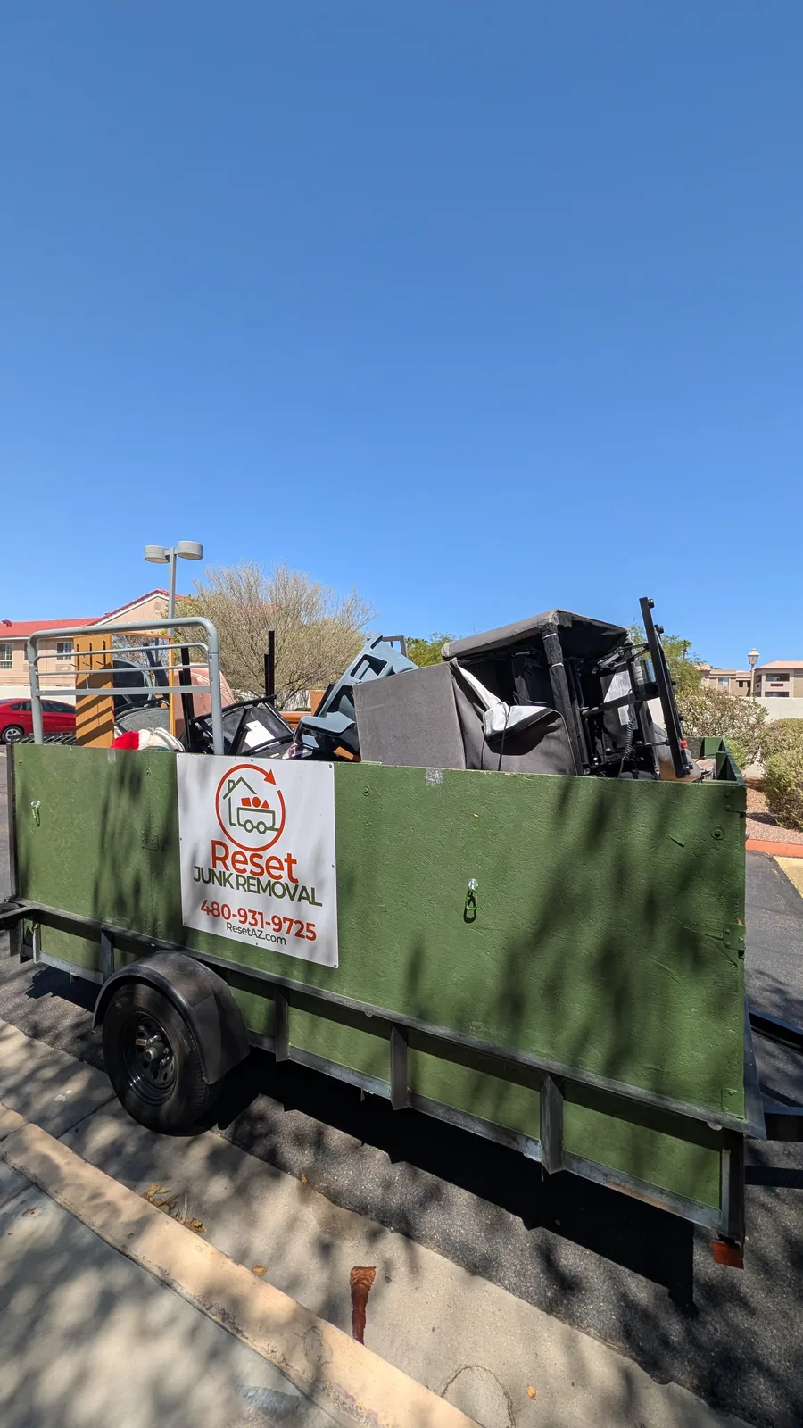 Reset trailer filled with furniture and household items after a Sun City pickup