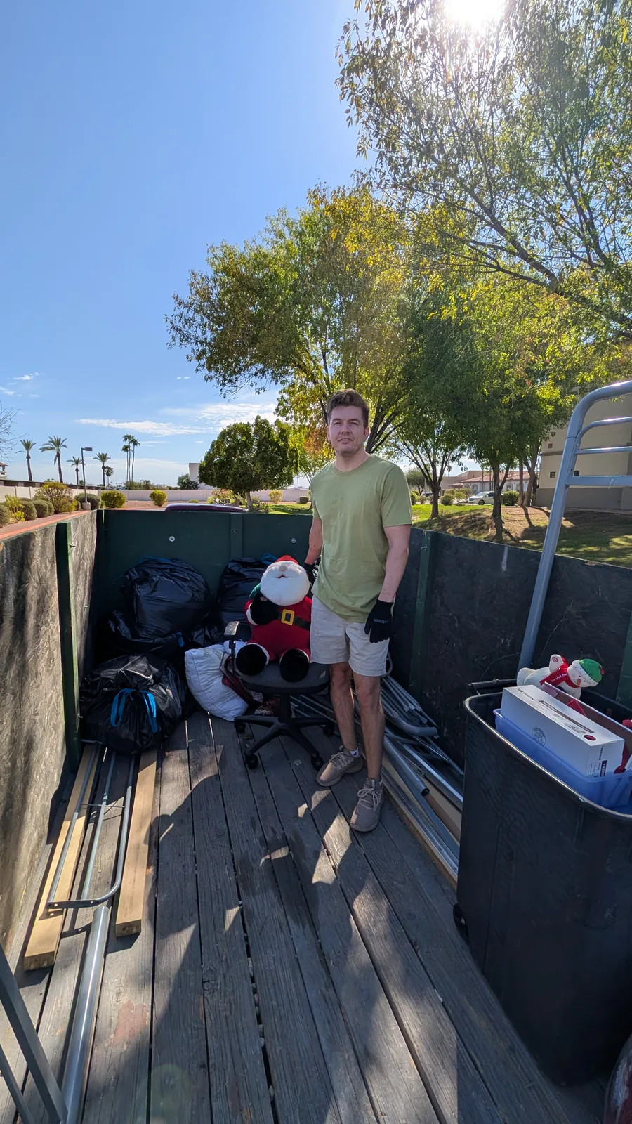 Mixed household items organized in the trailer during a Sun City cleanout