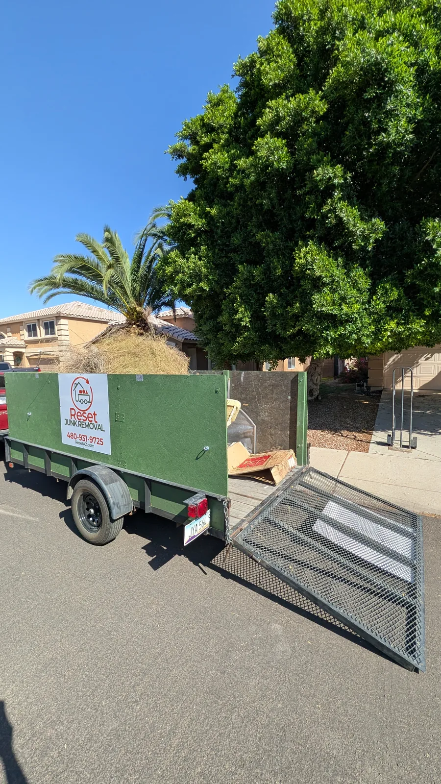 Reset trailer open during a brush and bulk junk pickup in Peoria