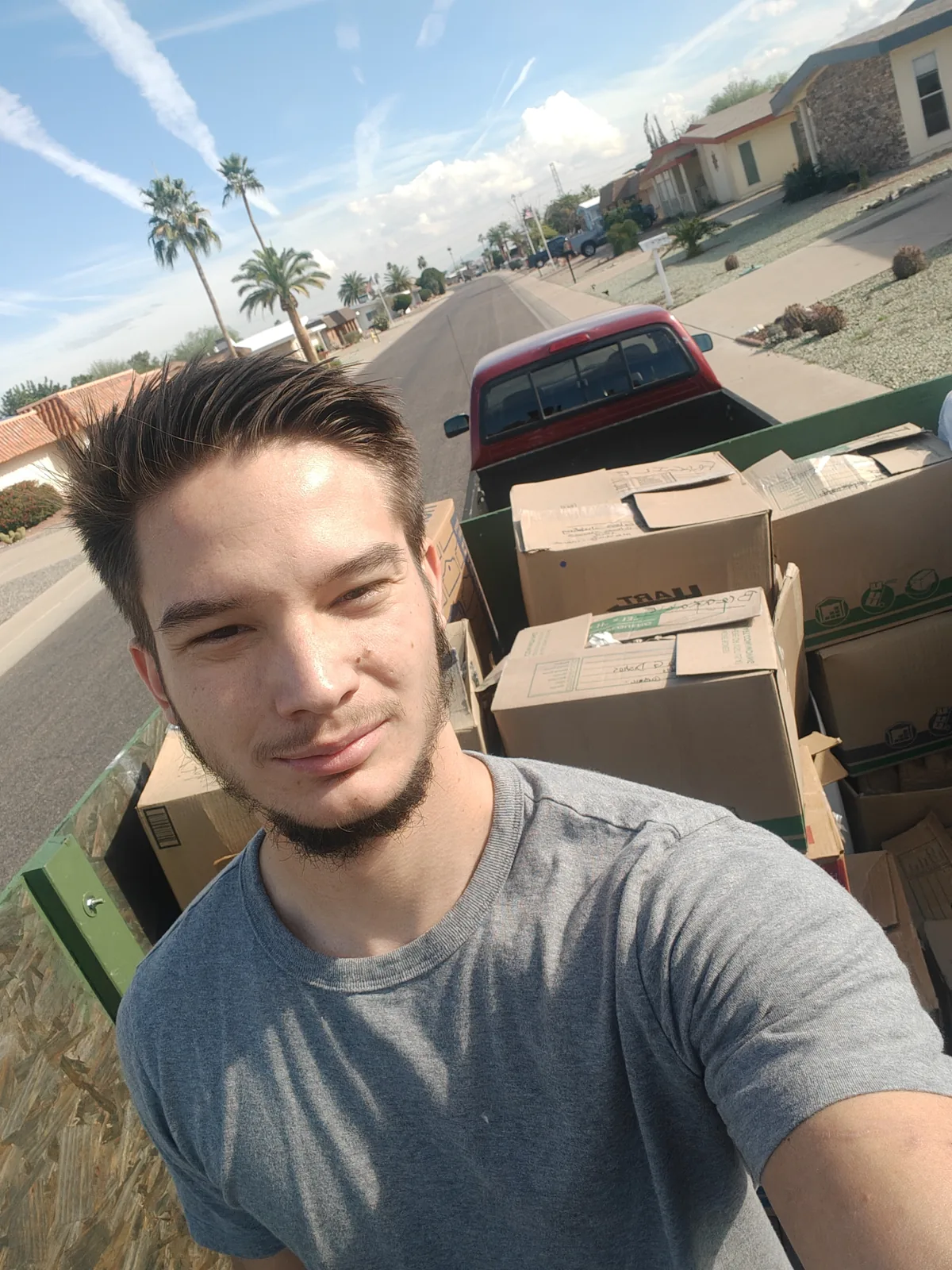 Reset crew member with a loaded cardboard and household junk trailer
