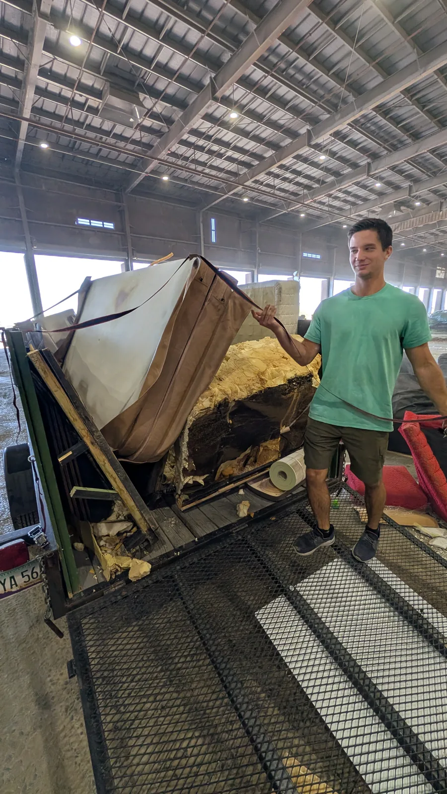 Loaded hot tub shell section at the end of the removal process
