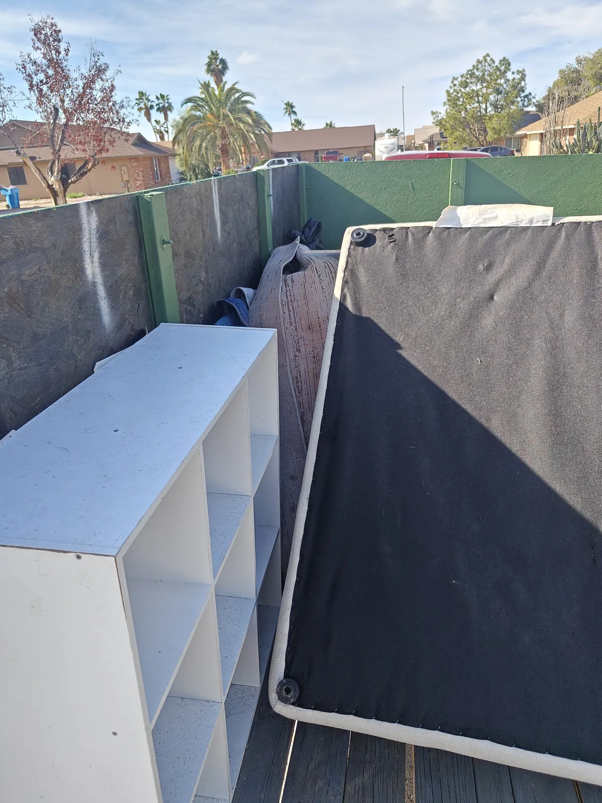 Shelving and a mattress or foundation in a North Phoenix furniture load