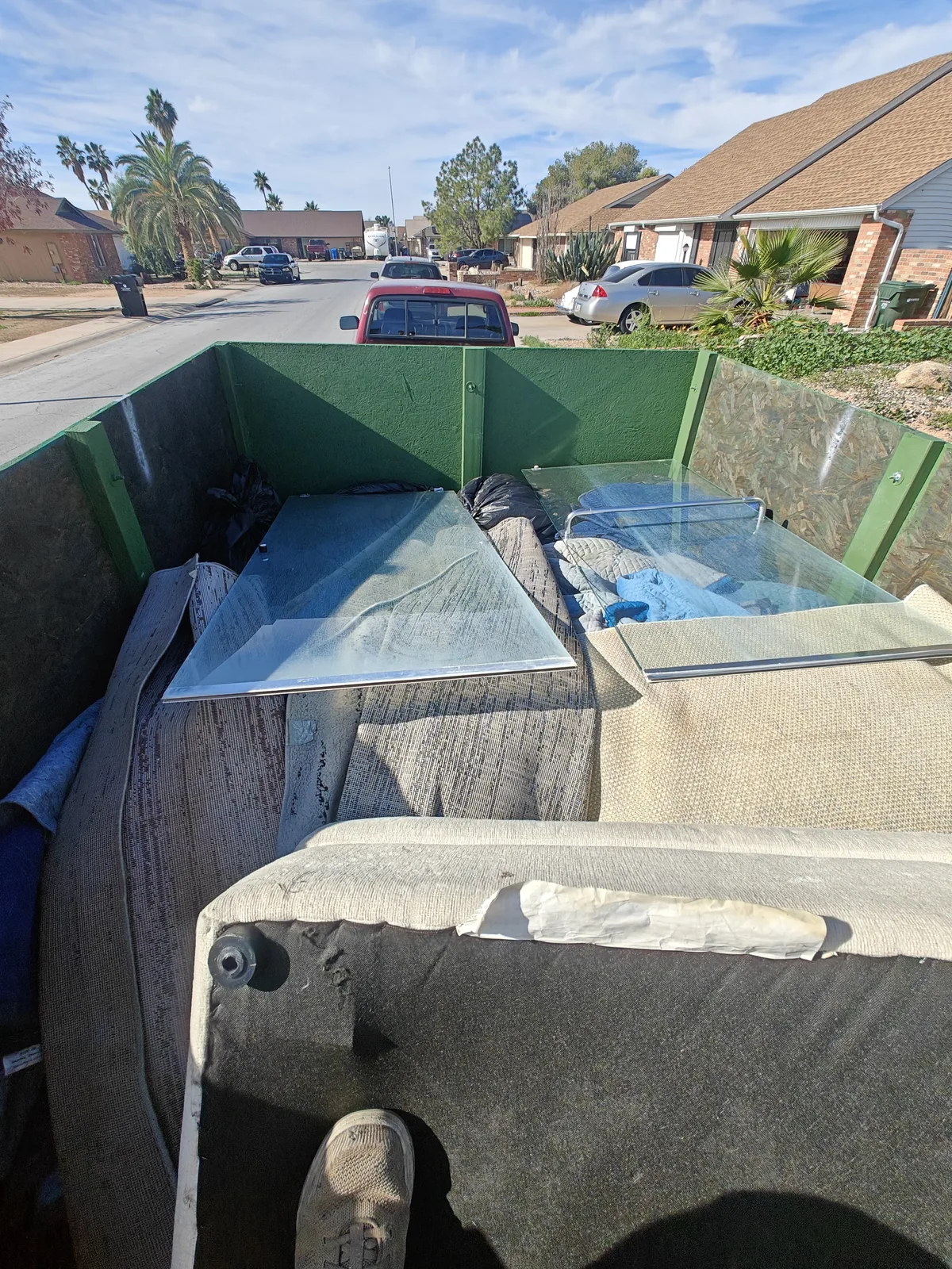 Upholstered furniture and a glass tabletop loaded in North Phoenix
