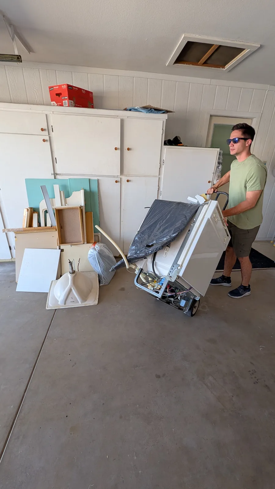 Large renovation panel being moved from a Sun City garage