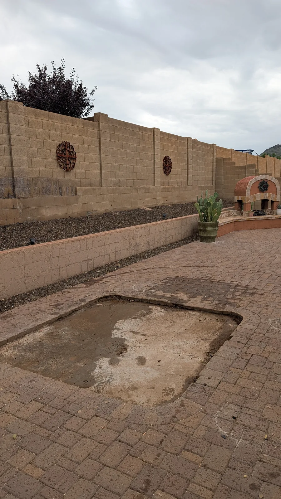Paver patio area after the hot tub was removed in North Phoenix