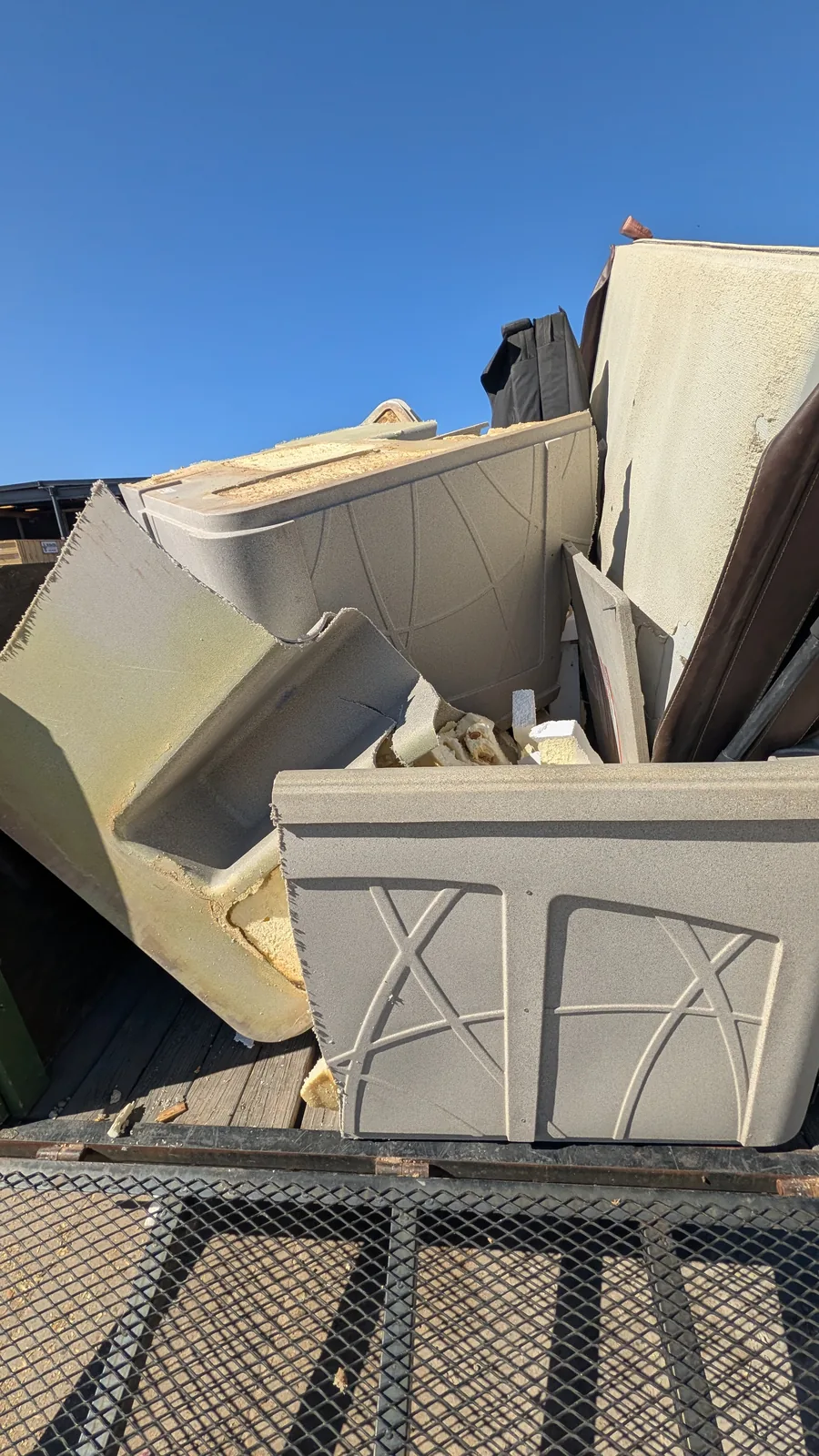 Hot tub shell and cabinet components loaded after a San Tan Valley removal