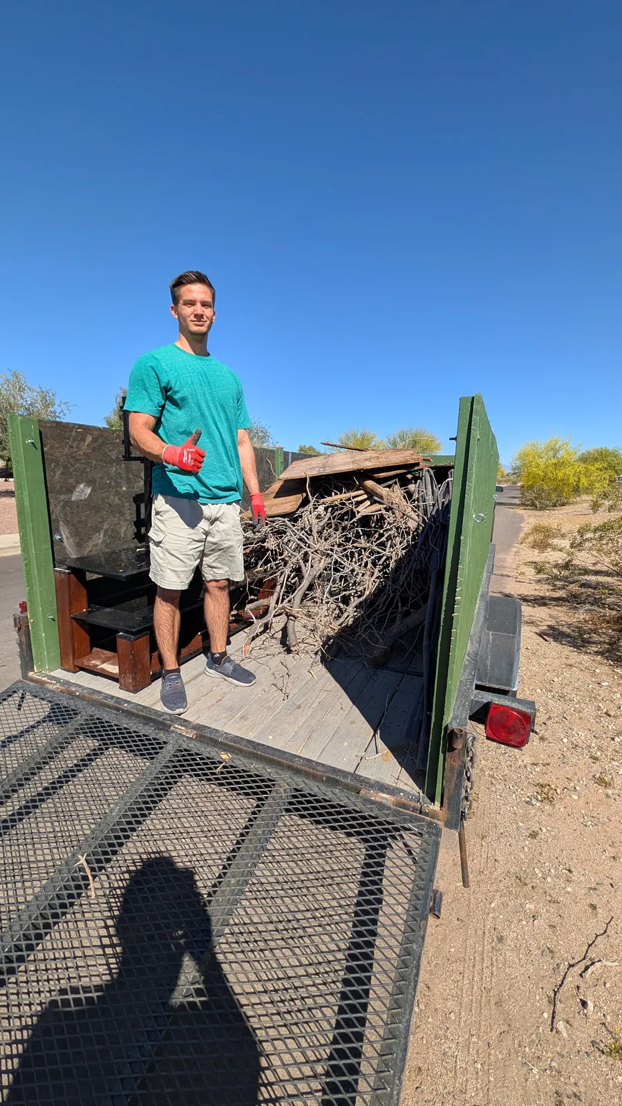 Branches and bagged debris added to a mixed Peoria removal load