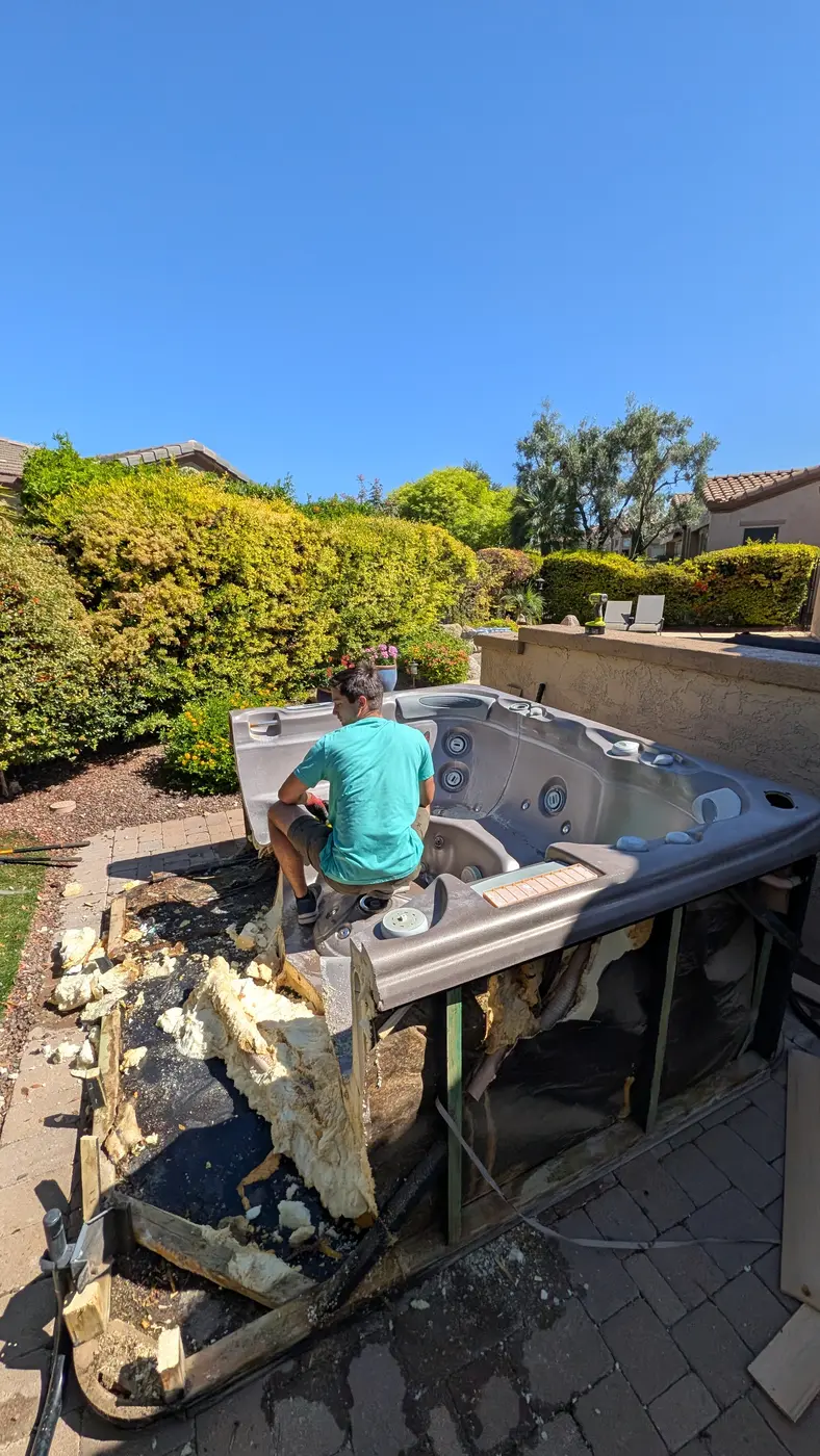 Hot tub removal in progress by Reset Junk Removal in Peoria