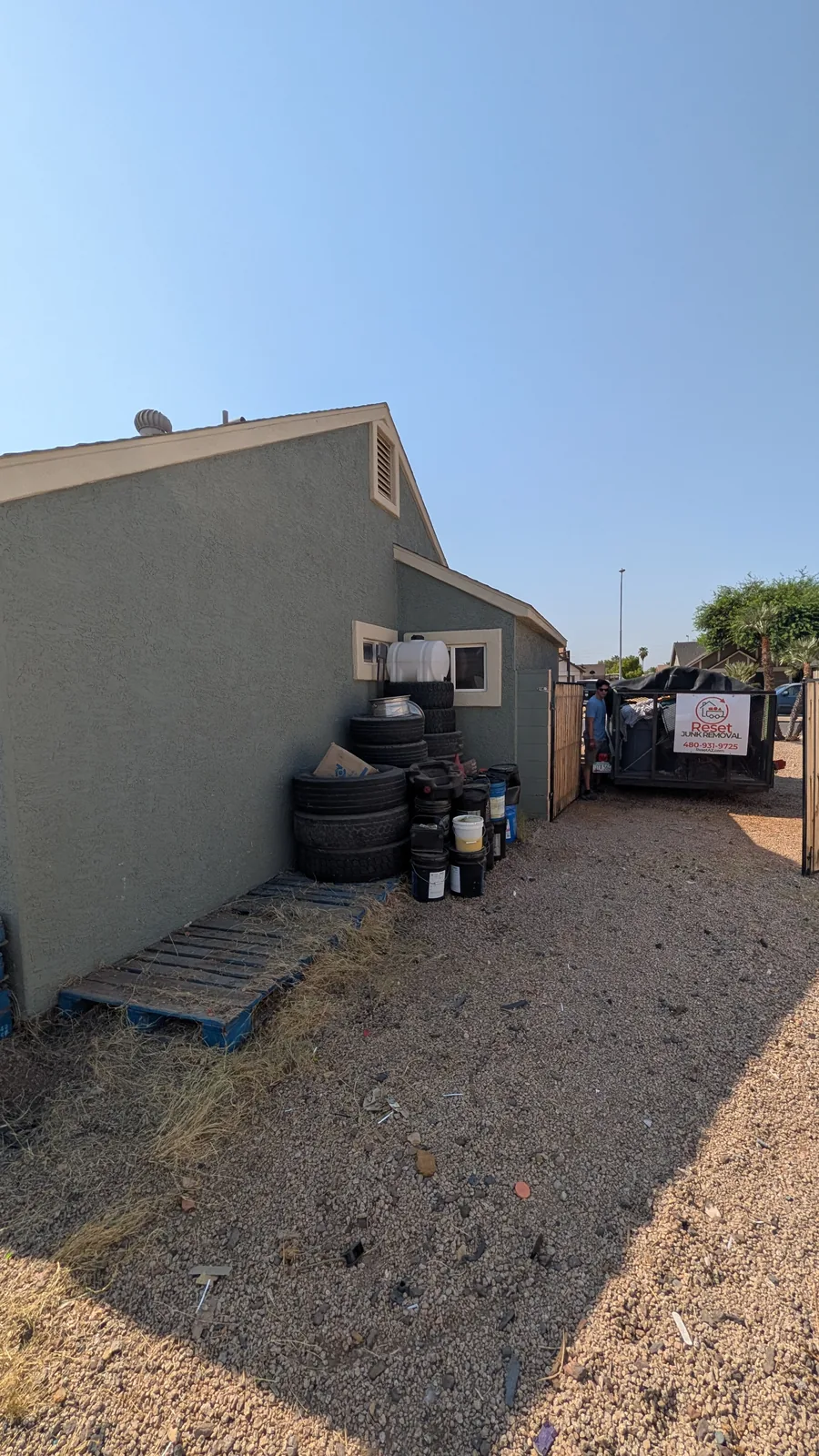 Side yard after the main bulk junk pile was removed in Peoria