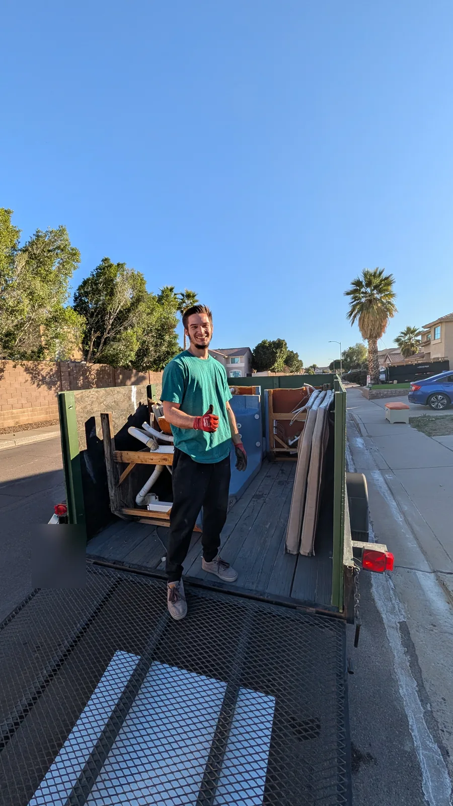 Reset crew member with the loaded hot tub trailer in Peoria