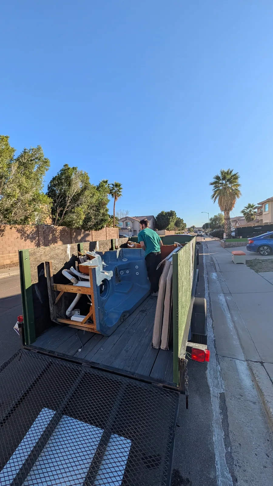 Dismantled hot tub material loaded in a trailer in Peoria