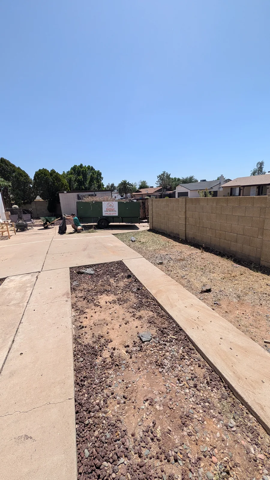 Cleared gravel and concrete area after North Phoenix yard cleanup