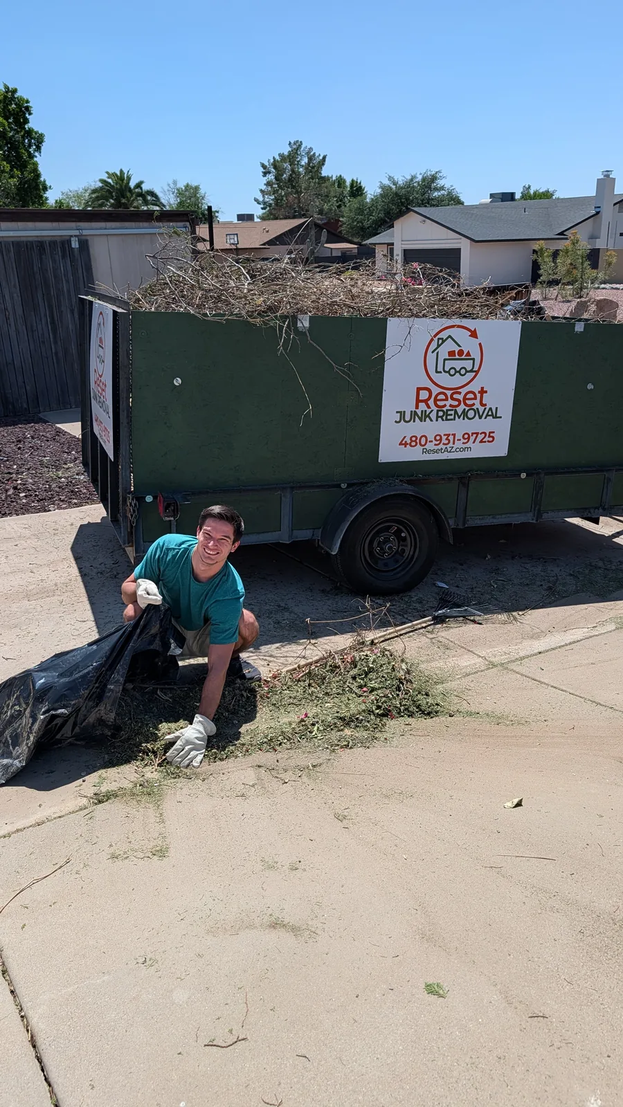 Yard debris being moved into the Reset trailer in North Phoenix