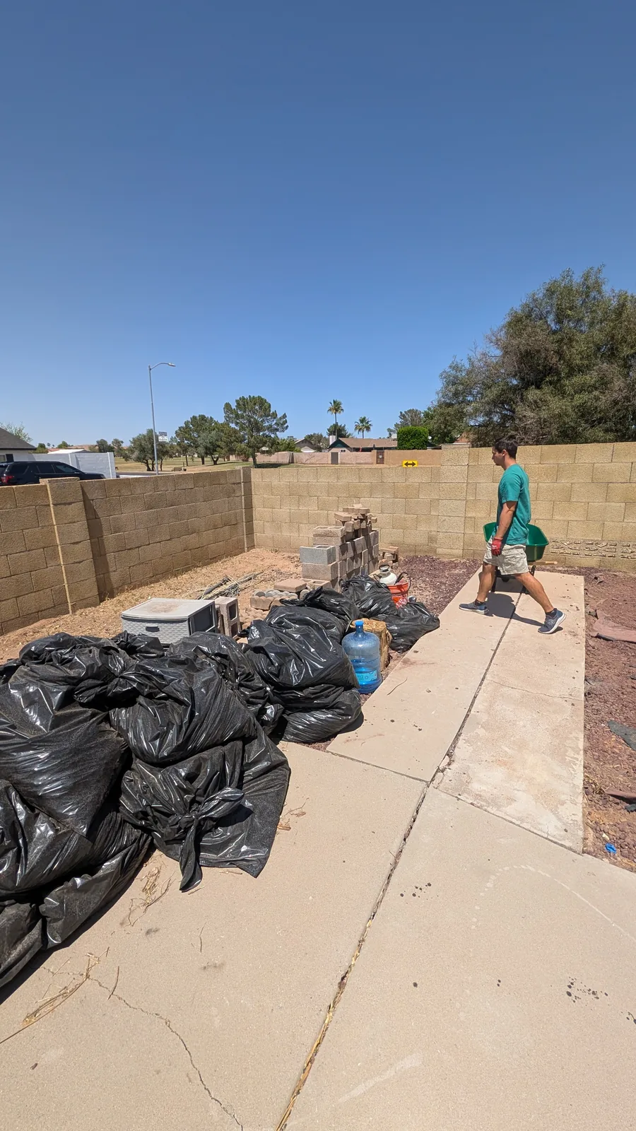 Reset crew loading staged yard debris in North Phoenix